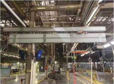 Aluminum overhead bridge crane in a metalworking facility