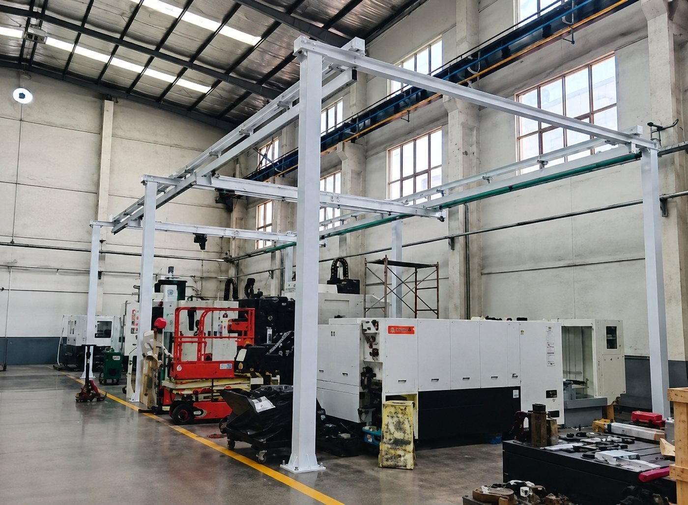 Freestanding aluminum crane support structure with portal frame columns